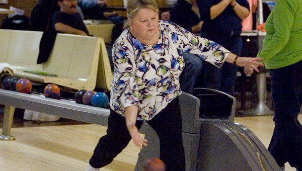Brenda Gregory bowls this past Tuesday night during a regular season match-up in the Suffolk Mixed Duckpin Bowling League at the Victory Lanes Bowling Center in Portsmouth. Gregory is the president of the league and owns the top average score per game among women in the league (111.43).