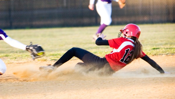 Nansemond River’s Morgan Lowers slides into second during Friday’s home game against Deep Creek High School. She was safe and went 4-for-4 as the Lady Warriors claimed a 9-3 win.