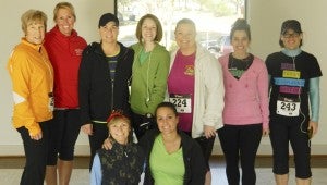Friends took a moment for pictures before beginning the race. Standing from left, Susan Saunders, Michelle Tomlin, April Matthews, Amber Pratt, Katelyn Harmon, Jenny Lewis and Andrea McHugh, and kneeling are Jackie Ahlsted and Kristin Cobb.