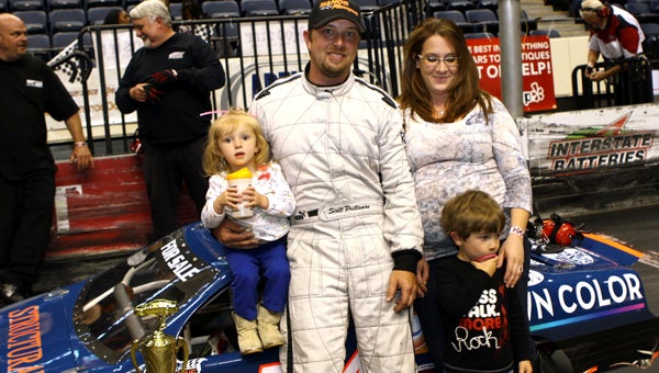 Scott Prillaman celebrates with daughter Brylee, wife Amy and son Ashton following his victory in the 50-lap Arena Racing USA Pro Series Top Dog event on Saturday. Prillaman’s 11th win of the season locked up his second Pro Series championship. (Bill Carr/MotorSports Photo News Service)