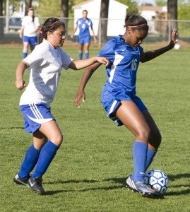 Nansemond-Suffolk Academy freshman Sophia Creekmore defends against Norfolk Collegiate School during a match-up on Thursday evening. The host Lady Saints hung tough for a half, but ultimately fell 7-1.