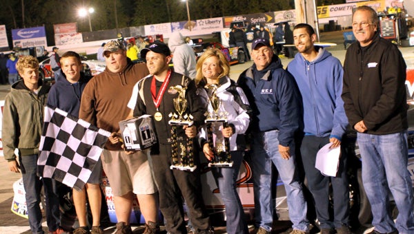 Matt Waltz celebrates in Victory Lane with his family and crew after his second win in the twin 75-lap events for the Late Model Stock Car class of the NASCAR Whelen All-American Series at Langley Speedway in Hampton on Saturday. In addition to the trophies, Waltz received Whelen Engineering Company’s gold medal for winning both 75-lap races on their sponsorship night. (Bill Carr/MotorSports Photo News Service)