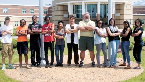 King’s Fork High School students and teachers Shawn Klepper, Teniya Benton, Treyvon Williams, Titus Barclift, Jay Miller, Toni Edwards (inclusion teacher), Randy Jessee (activities director), Morgan Hunt, Katelyn Hayden, Jiaya Pyron and Lindsay Ransome prepare to roll up their sleeves for a volunteer event this Saturday to spruce up the school.