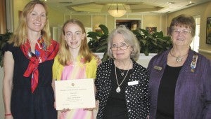 Constantia chapter of the Daughters of the American Revolution Regent Faye Sobel, right, and secretary Christine Young, second from right, present an American History essay contest award to Nansemond-Suffolk Academy fifth-grader Anna Paisley Gray, who is with her mother Eugenia Gray.