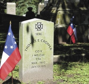 The graves of Thomas E. Cropper, foreground, and George Henry Crump, background, are both adorned with the Stars and Bars because they were Confederate veterans.
