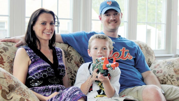 Wendy and Paul Marshall at home with 7-year-old Christopher Marshall, who was suspended from Driver Elementary School for pretending to shoot his classmate with a pencil.