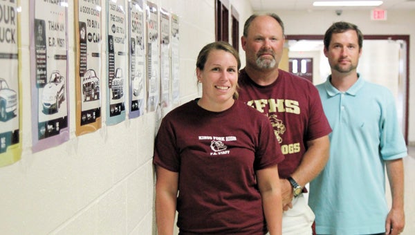 King’s Fork High School driver education instructors Katie Beodecker, Richard Froemel and Joshua Worrell say they work hard to prepare students for a lifetime of safe driving. Students at the school recently won a competition by lowering seatbelt violations.
