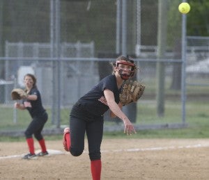 Nansemond River High School freshman pitcher Lauren Maddrey throws a Lady Bruins runner out at first base on Friday at Western Branch High School. The Lady Warriors suffered a blowout loss to Western Branch, 11-1.