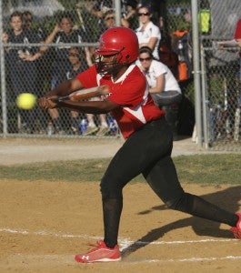 Nansemond River senior Jazmine Card connects with the ball during the Lady Warriors' 9-5 victory over Western Branch High School in the opening round of the Southeastern District tournament on Friday at Nansemond River High School.