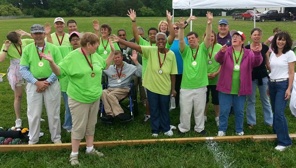 The Area 29 bocce team celebrates after receiving its medals during the recent Special Olympics Area 29 Suffolk Games at YMCA Camp Arrowhead.