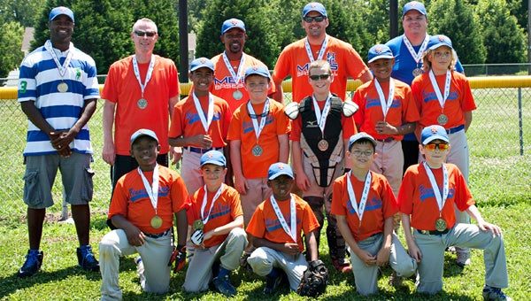 The Mets of Bennett’s Creek Little League’s Minor League division (ages 7-10) celebrates with their medals after defeating the Yankees 9-6 in the season-ending tournament championship game. Pictured are, front row, from left, Samuel Brannen, Drew Stark, Jalen Duckett, Sean Murphy and Mark Thompson; middle row, from left, Kanaan Graham, Cody McQueen, Jacob Prosper, Jakari Joy and Jackson Schuyler; back row, from left, Kevin Graham, Mark Prosper, Darien Brannen, Joe Stark and Sam Murphy. (Beansprout Photography by Sarah Murphy)