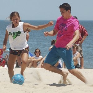 Danielle Stauffer of the SYAA’s U-19 Lightning prepares to kick the ball in one of the team’s three games this past weekend at the Buckroe Sand Soccer tournament on Buckroe Beach in Hampton. (Stacy Pauley photo)