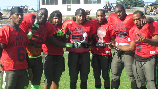 The Suffolk Chargers helped power the South team to victory in the Atlantic Coast Football Alliance's spring 2013 all-star game on Saturday in Annapolis, Md. The South defeated the North 6-0, thanks to strong defense, which included Ricky Taylor's 35-yard interception return for a touchdown. Taylor, center, holds his game MVP trophy while Andre Harper holds the trophy acknowledging the Chargers as having been champions of the league's Tidewater Division. From left: Swendell Stephens, Daryl Greene, Charlie Keys, Ricky Taylor, Andre Harper, Daquon Frazier and Walter Boykins.
