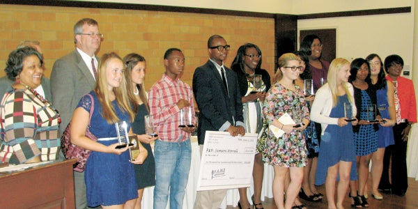 Honorees and speakers at the Suffolk Youth Achievement Awards take a photo at the Suffolk Center for Cultural Arts on Tuesday. In the photo are City Attorney Helivi Holland, youth supporter award recipient Mike Bigony, City Councilman Charles Parr, honorees Jessica March, Skylar Wall, Kayron Saunders, Samson Worrell, Jasmine Parham, Sydney Pressley, Orquidea Aleagha, Brittany Corner, Kayla Vincent, Ashley Roten, Emily Grace Bazemore and City Manager Selena Cuffee-Glenn.