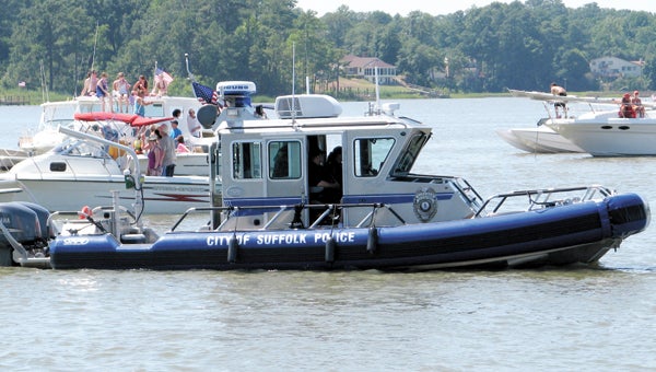 The Suffolk Police Department’s Marine Patrol boat supervises Independence Day festivities on the Chuckatuck Creek in 2010. Boating safety will be a prime concern of the police department this holiday week and throughout the summer, a spokesman says.