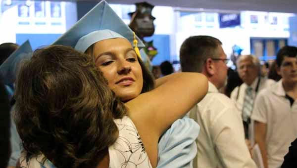 Debi Brooks gives new Lakeland High School graduate Brittany Brooks a big hug. The commencement ceremony at the school Saturday was a celebration of the fruits of hard work for Brittany Brooks and her classmates.