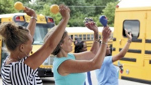Danielle Hare and Darlene Carter wave goodbye to their charges at Northern Shores Elementary School