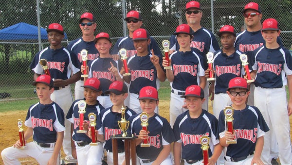 The Windsor Nationals Bronco Division baseball team swept the competition in the spring season of the Western Tidewater Pony League, registering 14 wins by slaughter rule and finishing with a perfect 17-0 record. Front row, from left: Garrett Blatt, Derrick Daye, Logan Johnson, Sam Shepard, Austin Ducceschi and Will Flanders; middle row, from left: Tylor Butler, Gabriel Ward, Marcus Jones, Nick Donovan, Jacob Council and Ethan Rogers; back row, from left: coach Frank Blatt, coach Chris Ward, coach Richard Donovan and head coach Jeff Rogers. Not pictured: scorekeeper Sterling Johnson. (Christina Daye photo)