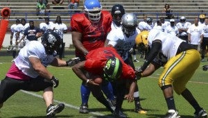 Walter Boykins of the Suffolk Chargers works hard for more yardage as a member of the South team in the Atlantic Coast Football Alliance's spring 2013 all-star game on Saturday in Annapolis, Md. The South defeated the North 6-0. (Angela Harper photo)
