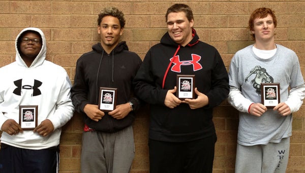 Eighth-grader Dia Gray, sophomore Leon Lynch and juniors Caleb Repko and Aaron Hommell hold up plaques commemorating their having placed among the top eight finalists in their events at the Middle Atlantic Wrestling Association Eastern National Championships in Salisbury, Md. in early May. In doing so, all four earned the title of All-American.