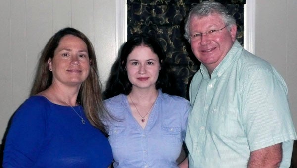 Ashley Saunders stand with her parents, GMC Roy M. Saunders, USCG (Ret.) and Lalona Saunders. Ashley recently was awarded a Coast Guard Foundation scholarship.