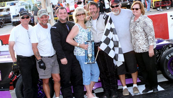 Jimmy Humblet (with flag) celebrates with family members and crew after the first of his twin 30-lap wins in the Modifieds class of the NASCAR Whelen All-American Series at Langley Speedway in Hampton last Saturday. (Bill Carr/MotorSports Photo News Service)