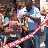 Tracy Agnew/Suffolk News-Herald  Opening: Vice Mayor Charles Brown helps Kawanna Ward cut the ribbon on Providence Psychological Services last week.