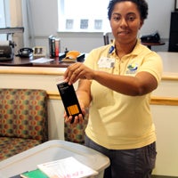 At East Suffolk Recreation Center, one of many collection points around the city, Tabitha Franklin shows some of the items folks are encouraged to donate during a school supplies drive. 