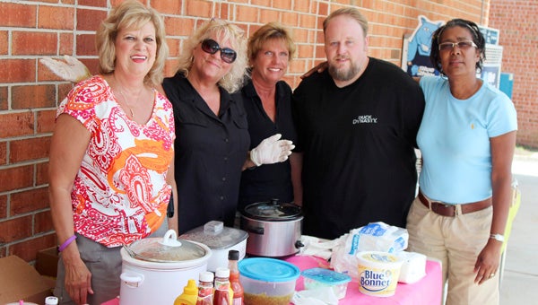Folks from Rite Aids around the area pitched in at the Holland Road store to raise money for a young cancer victim, the daughter of another store manager. Pictured on Friday are Pam Allen, Linda Johnson, Pat Young, Greg Williams and Bessie Hunt.