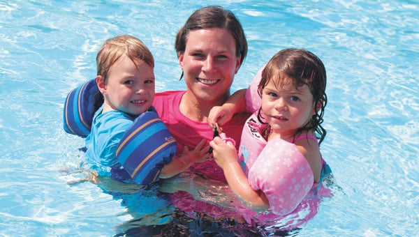 At Kempton Park Pool in North Suffolk Wednesday, Clay, 2, and Samantha, 3, Davis beat the heat with mom Suzanne Davis.