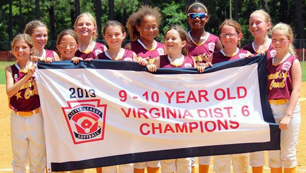 The Bennett’s Creek Little League 9/10-year-old softball all-star team holds up a banner recognizing its status after winning the Virginia District 6 All-Star Softball 9/10-year-old tournament on July 4 at Churchland Park. Pictured are, front row, from left, Elizabeth Culbert, Taylor Whitley, Hailey Adkins, Isabel Metzger, Paige Breneman and Emily Mousso; back row, from left, Kailey Dorcis, Madison Wright, Covanna Bynum, Nyah McNeal and Shannon Monahan. | Daena Mousso Photo 