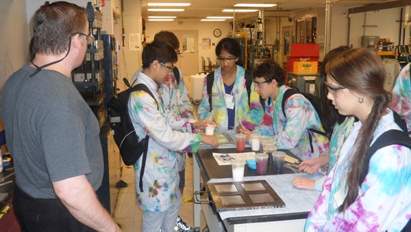 Participants in the 2013 BASF Science Academy perform an experiment during the two-week summer science program at Fairleigh Dickinson University College at Florham in Madison, N.J.