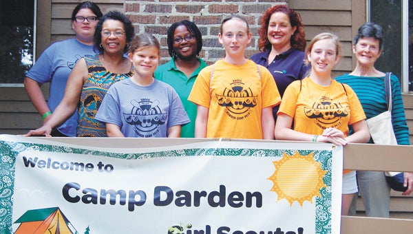 Visitors to Camp Darden posed for a photo with girls at the camp who live in Delegate Tyler’s district. From left are Holly Cook of Windsor, Delegate Roslyn Tyler, Marnie Mitchell of Smithfield, Cheryl Thomas of Courtland, Katie Henk of Smithfield, Girl Scouts of the Colonial Coast CEO Tracy Keller, Allison Linner of Suffolk and Irene Darden Field.