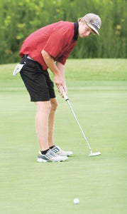 Nansemond River High School senior Griffin Genier putts during his round of 74 on Thursday that helped his team defeat King’s Fork High School 343-444 at Nansemond River Golf Club. Genier is the No. 1 player for the Warriors this year.