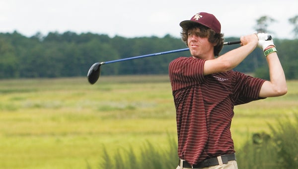 King’s Fork High School senior Griffen Saylor drives on Thursday during a match against NRHS.