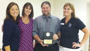 Jason Pittman receives the plaque recognizing the city of Suffolk for its Hope Sponsorship of the 2013 Suffolk Relay For Life. Presenting the plaque are Heather Spivey Howell, Chair Ginny Lee Melton and community manager Angela Francis.