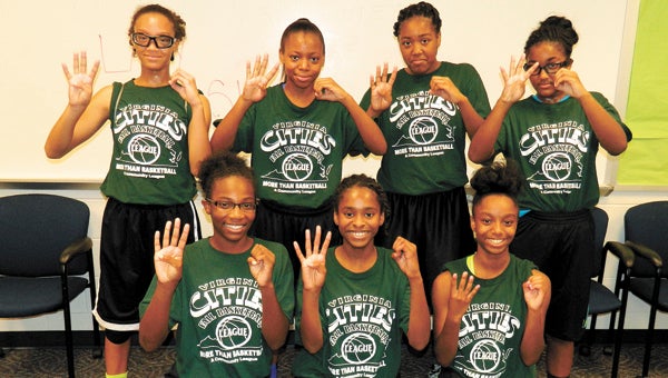 The Suffolk Lady Storm of the Virginia Cities Fall Basketball League gesture to communicate their record of 4-0 after defeating Chesapeake (Perry) on Saturday by the score of 25-19. Front row, from left: Ashly Robertson, Makaylyn Davis and Kaylah Brown; back row, from left: Necole Brown, Briana Autrey, Alira Hinton and Brianna Copeland. Not pictured: Camry Harris, Makayla Dickens and Hayley Duckett.