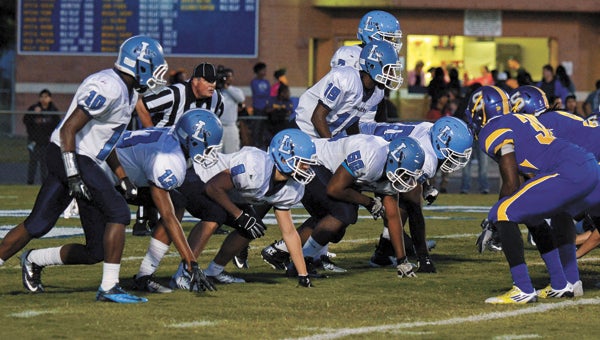 The Lakeland High School Cavaliers lined up against a difficult opponent on Friday night in host Oscar Smith High School, but self-inflicted turnovers proved to be their biggest issue. Nonetheless, the Cavs made their coach proud by continuing to fight in the face of a 56-6 loss. (Melissa Glover photo)
