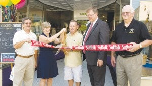 Karen and William James, owners of All About Virginia & More, celebrate its opening.