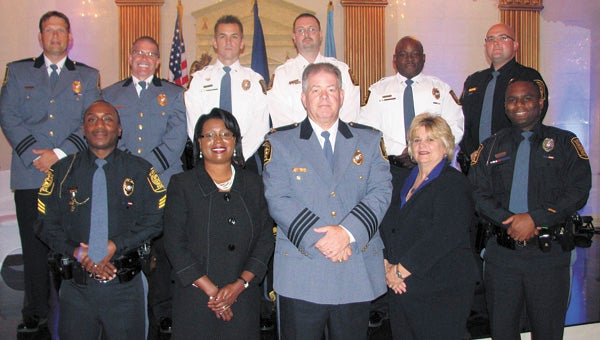 Promotees and city officials at a Suffolk Police Department ceremony at The First Lady. Front row from left, Sgt. Raul Hutson, City Manager Selena Cuffee-Glenn, Chief Thomas Bennett, Mayor Linda T. Johnson and Master Police Officer William Shockley. Back row from left, Maj. Steve Patterson, Capt. James Buie, Lt. Adam Smith, Lt. Mark Erie, Lt. Alfred Chandler and Sgt. James Sobers.