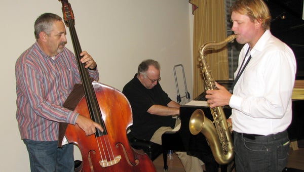The Jimmy Masters Trio - from left, Jimmy Masters, Harris Simon and Steve Stelmaszek - provides background music for the sponsors' reception at Art d'Vine.