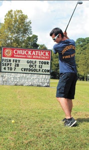 Volunteer firefighter Ryan Foster tees up Monday ahead of Chuckatuck Volunteer Fire Department’s Oct. 12 charity golf tournament. A fish fry fundraiser will be held beforehand, on Sept. 28.