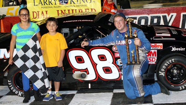 Landon Florian stands in Victory Lane with Larry King Law trophy presenters after Florian’s fifth win of the year in the Pro 6 division at the NASCAR Whelen All-American events on Saturday at Langley Speedway. (Bill Carr/MotorSports Photo News Service)