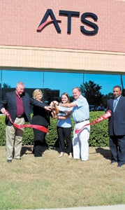 Mayor Linda T. Johnson and company officials cut the ribbon to open the new Harbour View location of technology company Applied Technical Systems on Thursday. Relocating within Harbour View, the company has doubled its floor space in anticipation of future growth. Councilmen Roger Fawcett and Lue Ward were also at the event.