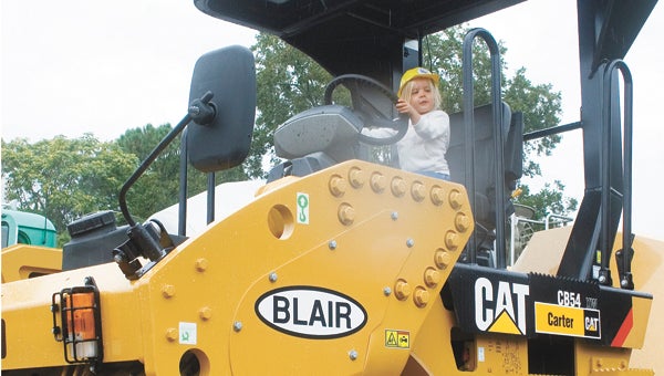 A girl checks out a piece of construction equipment at last year’s Touch a Truck, Train and More event at the Suffolk Seaboard Station Railroad Museum. This year’s event will be held Oct. 5.