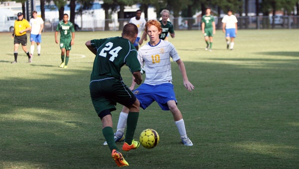 Nansemond-Suffolk Academy sophomore midfielder Patrick Crossman looks to close off the path of a Trinity Episcopal School player on Friday. The Saints lost 3-2 at home, but showed the possibility of good things to come in the back half of the season by scoring their first goals of the year. (Titus Mohler/Suffolk News-Herald)