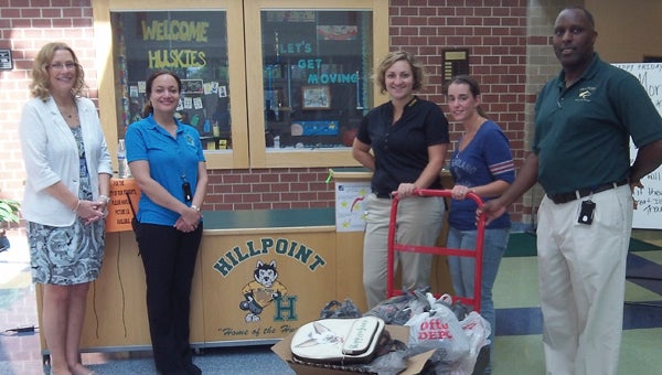 At Hillpoint Elementary School, gifted resource teacher Julie Plasencia, assistant principal Catherine Pichon, and principal Dr. Ronald Leigh take delivery of a batch of school supplies from Planters Peanuts’ Tina Cengic and Malika Stepasiuk.