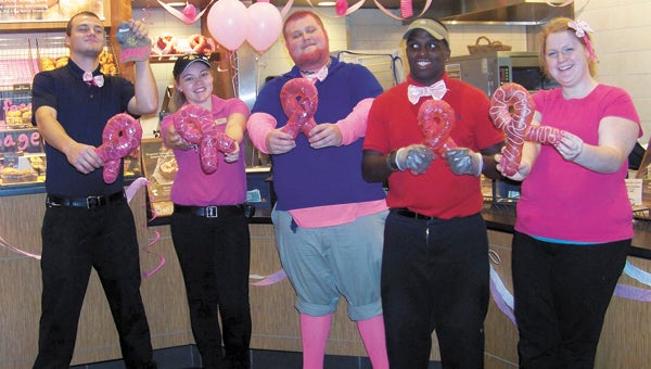 From left, Aidan Youngerman, Heather Edwards, John Marx, Gregory Hill and Catherine Foreman helped Panera Bread on North Main Street go all out on Monday in support of National Breast Cancer Awareness Month. All proceeds from Panera's signature Pink Ribbon Bagel were donated to the Susan G. Koman Foundation. Managers Doug Knapp, Daniel Foxwell, Beverly Hall, Julien King and Jeffery Miller helped Panera workers set up for the “Pink Out Day,” and workers Imari Griffin, Catherine Foreman, Heather Edwards, Beth Redd, Sierra Hodge and others helped decorate the cafe. Diana High, the baker at Panera, made all the bagels and spent extra time creating baguettes shaped and colored like ribbons that featured in the photo.