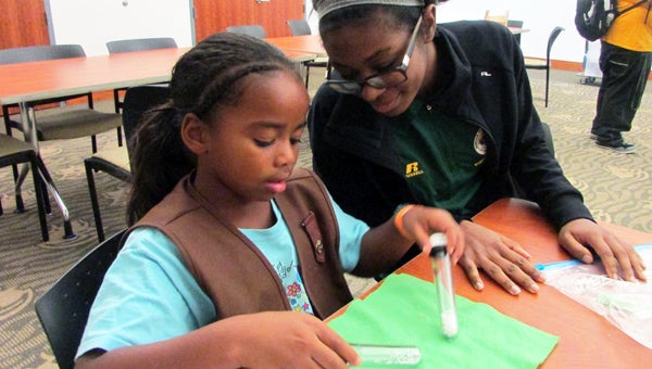 Angelina Dickens and Rae Corbo work together on a science project at the Science Alive event at Norfolk State University on Sept. 28. (Submitted Photo)