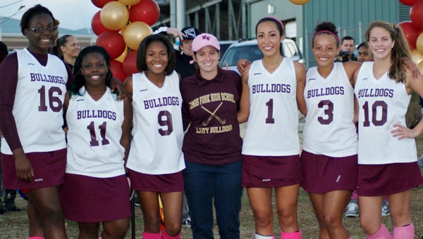 The seniors of King’s Fork High School’s field hockey team gathered with their coach on Wednesday evening after two of them scored in a 2-0 win over visiting Smithfield High School. From left: Chiamaka Akujuobi, Calnesha Brown, Naajia Lyons, head coach Courtney Van der Linden, Kana Hashigami, Maiah Wright and Holly Wilson.